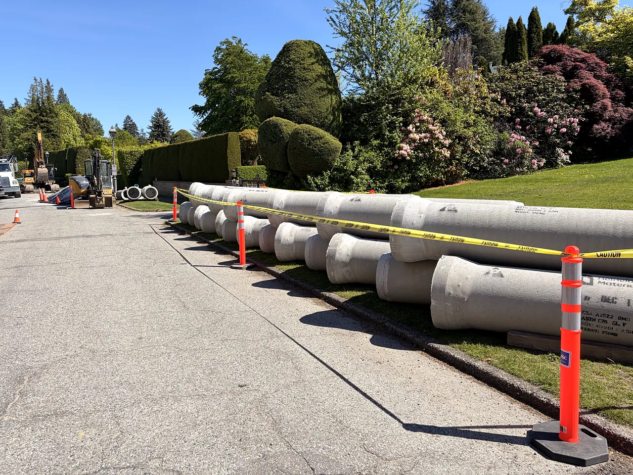 Concrete storm pipe staged along Kingston Road